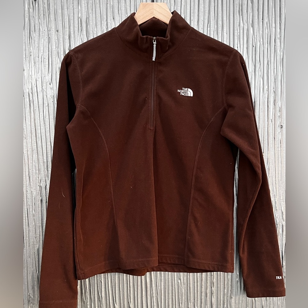 The North Face fleece half zip pull over.